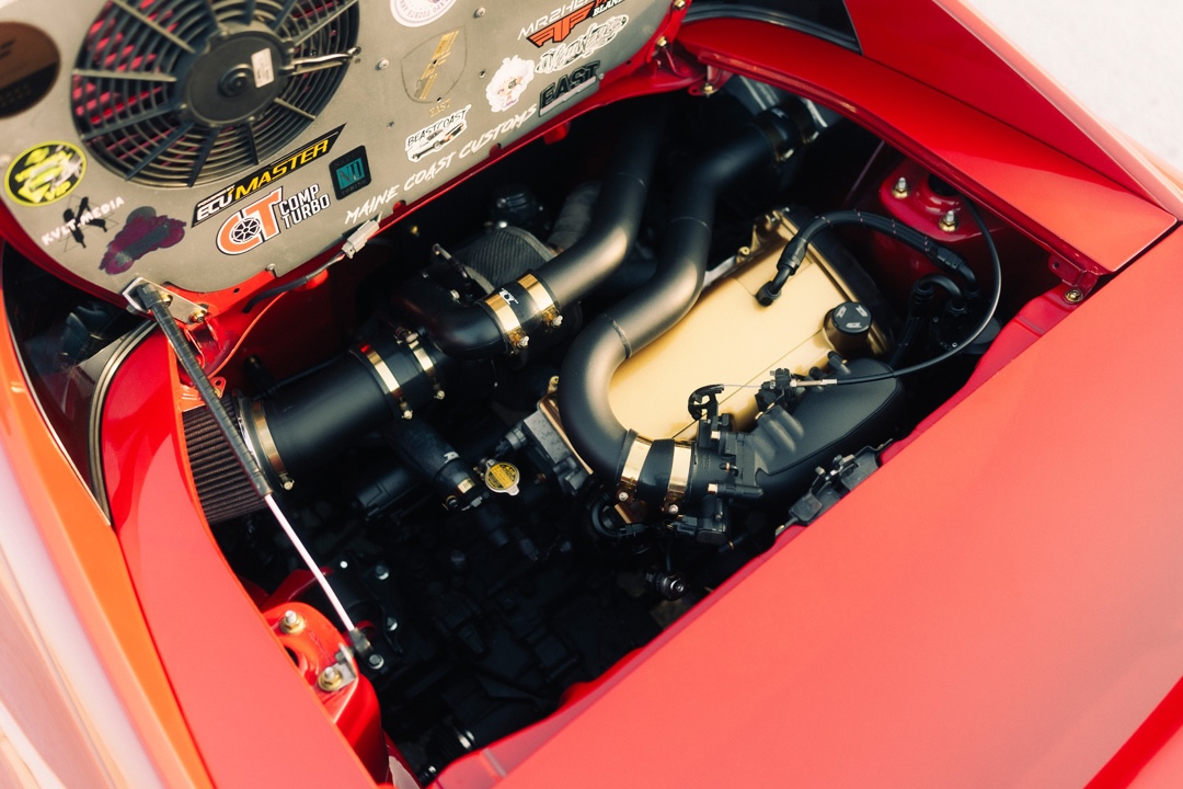 Shaved 3SGTE engine bay in John Santos 1991 Toyota MR2 with custom piping and clean wire tuck