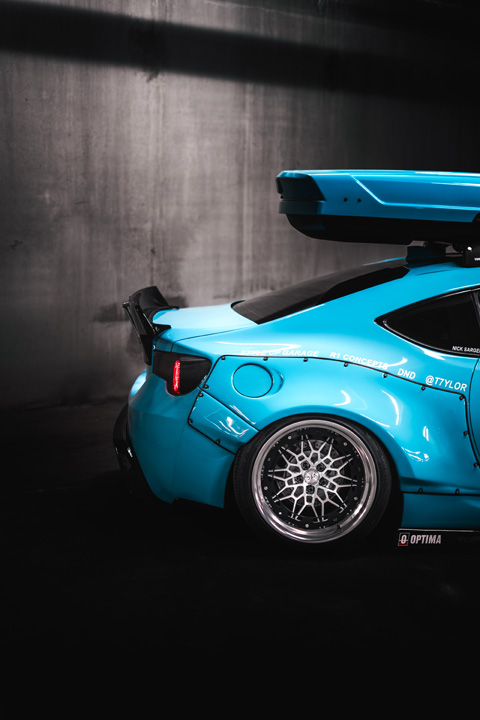 Low-angle view of Nicholas Sargeant’s Scion FR-S showing its widebody stance and custom exterior styling.