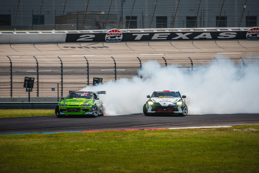 Custom Mazda Miata with an anime-inspired livery displayed in the FuelFest Dallas-Fort Worth show field at Texas Motor Speedway.