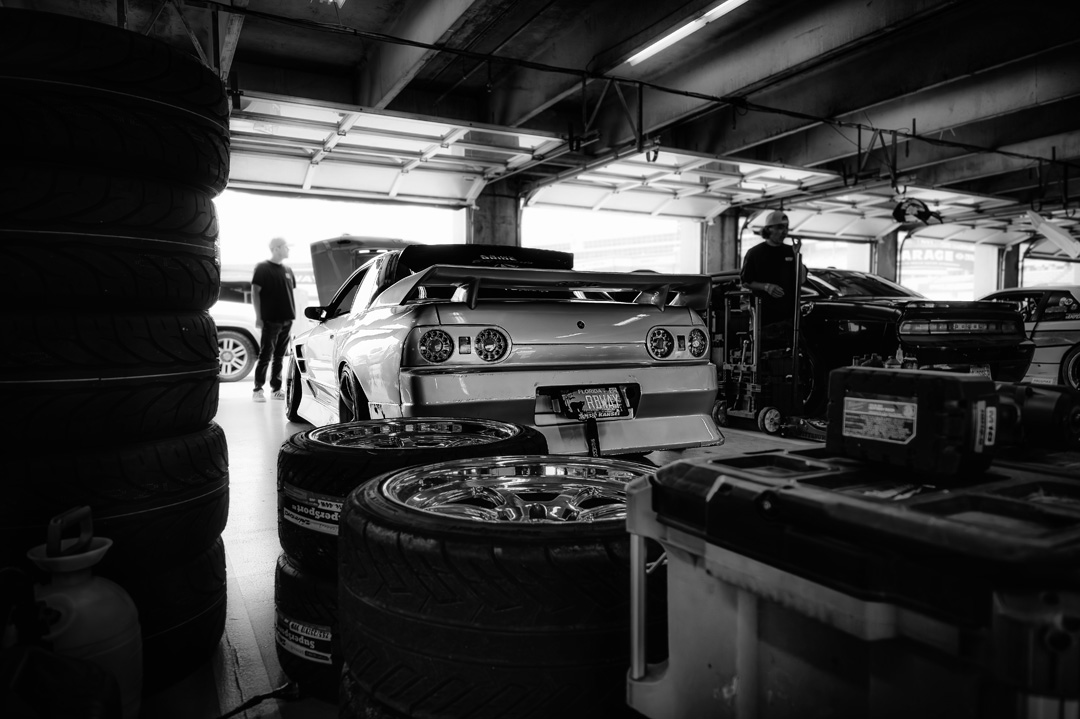 Drift cars lined up inside the paddock during FuelFest Dallas-Fort Worth.