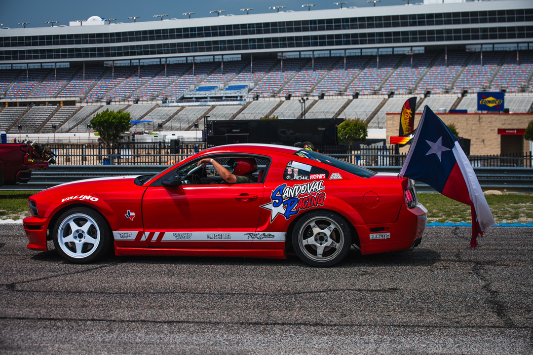 Modified show cars and spectators during FuelFest Dallas-Fort Worth at Texas Motor Speedway.