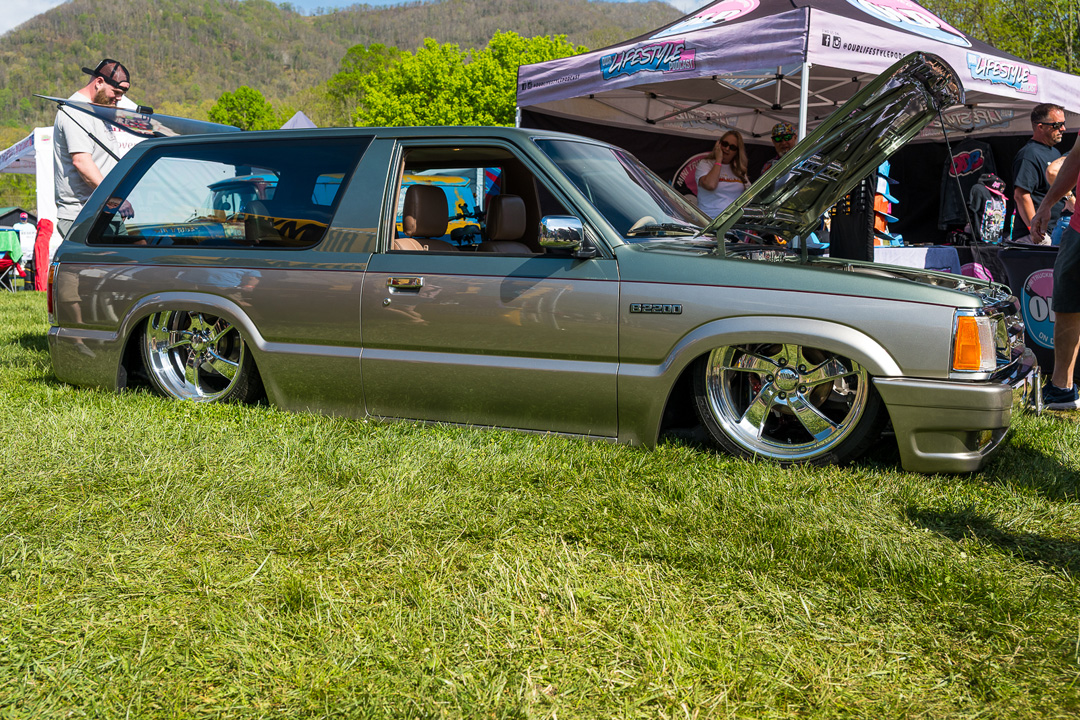 Lowered custom Chevy Blazer Mazda B2200 on polished wheels displayed at Mini Truckin’ Nationals.