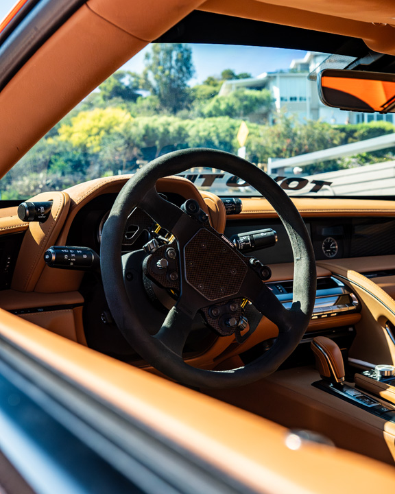 Interior view of Cassandra Balthasar’s Lexus LC500 showing the tan cabin and Zestek steering wheel.