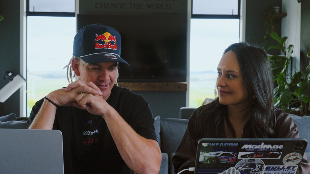 Two team members reviewing the FORMIDABUL Formula One drift car project during a planning session.