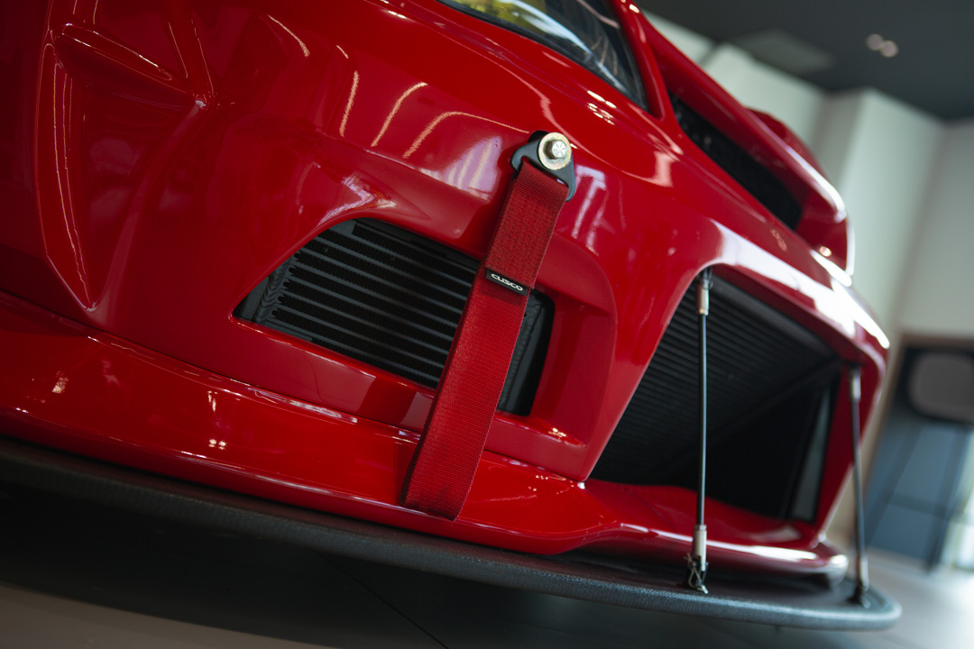 Jon Erickson’s red LS-swapped 2011 Subaru STi with widebody aero and track-focused details.