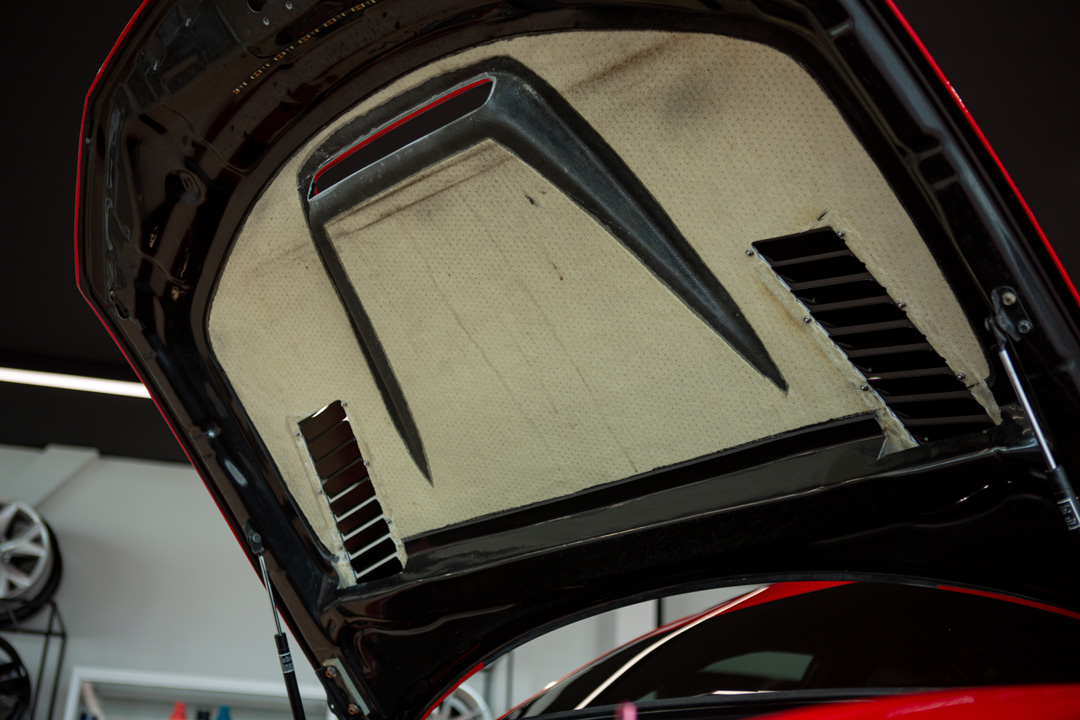 Jon Erickson’s red LS-swapped 2011 Subaru STi with widebody aero and track-focused details.