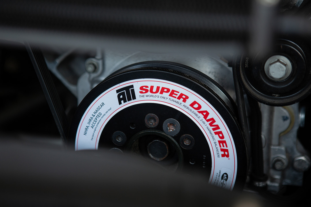 Jon Erickson’s red LS-swapped 2011 Subaru STi with widebody aero and track-focused details.