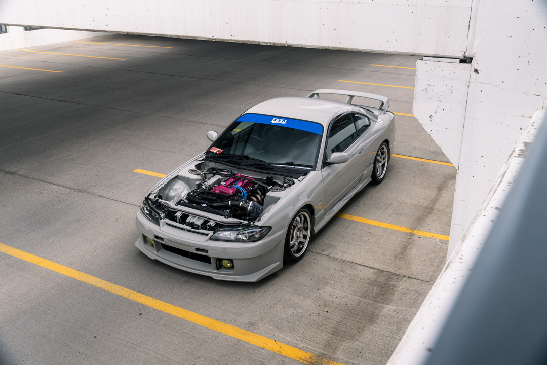 Bill MacKenzie’s Porsche Chalk 2000 Nissan Silvia S15 with handmade custom details, Nismo aero, Super Advan V2 wheels, naturally aspirated SR engine setup, and restomod-inspired interior and exterior work.