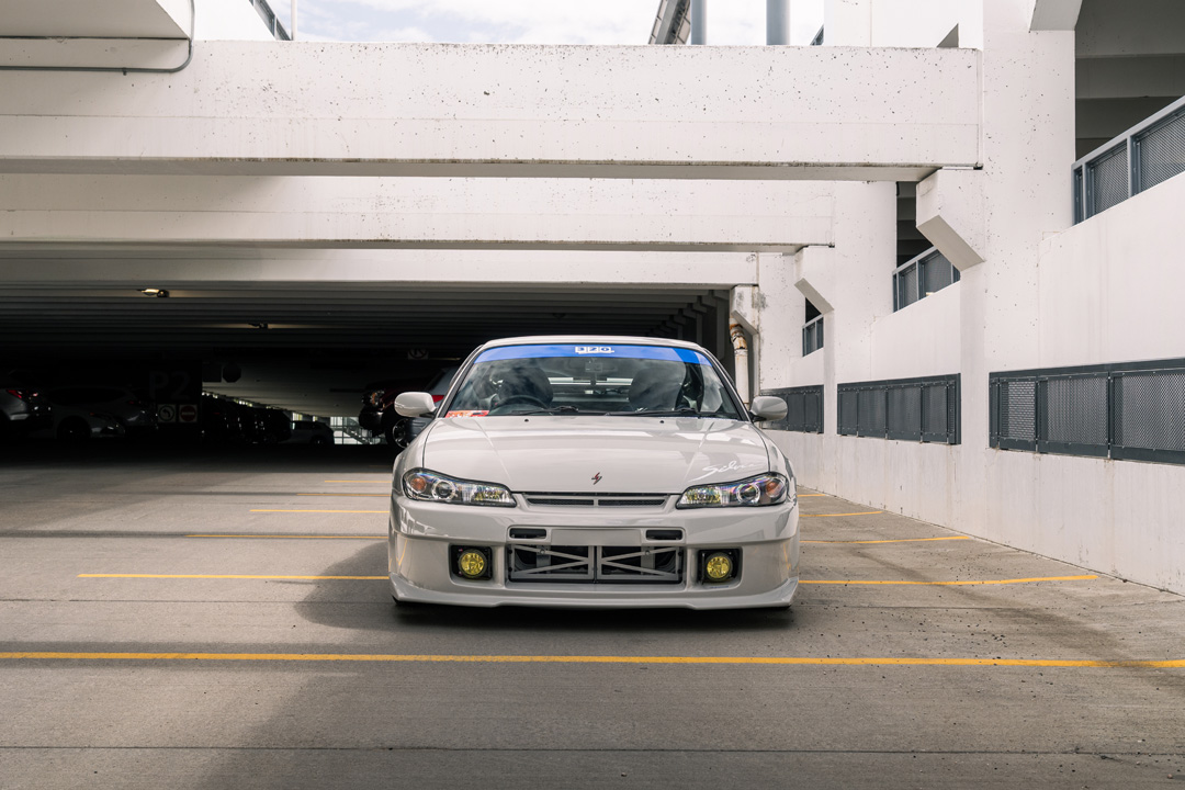 Bill MacKenzie’s Porsche Chalk 2000 Nissan Silvia S15 with handmade custom details, Nismo aero, Super Advan V2 wheels, naturally aspirated SR engine setup, and restomod-inspired interior and exterior work.