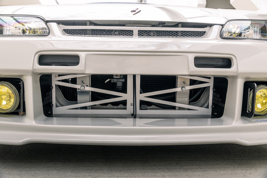 Bill MacKenzie’s Porsche Chalk 2000 Nissan Silvia S15 with handmade custom details, Nismo aero, Super Advan V2 wheels, naturally aspirated SR engine setup, and restomod-inspired interior and exterior work.