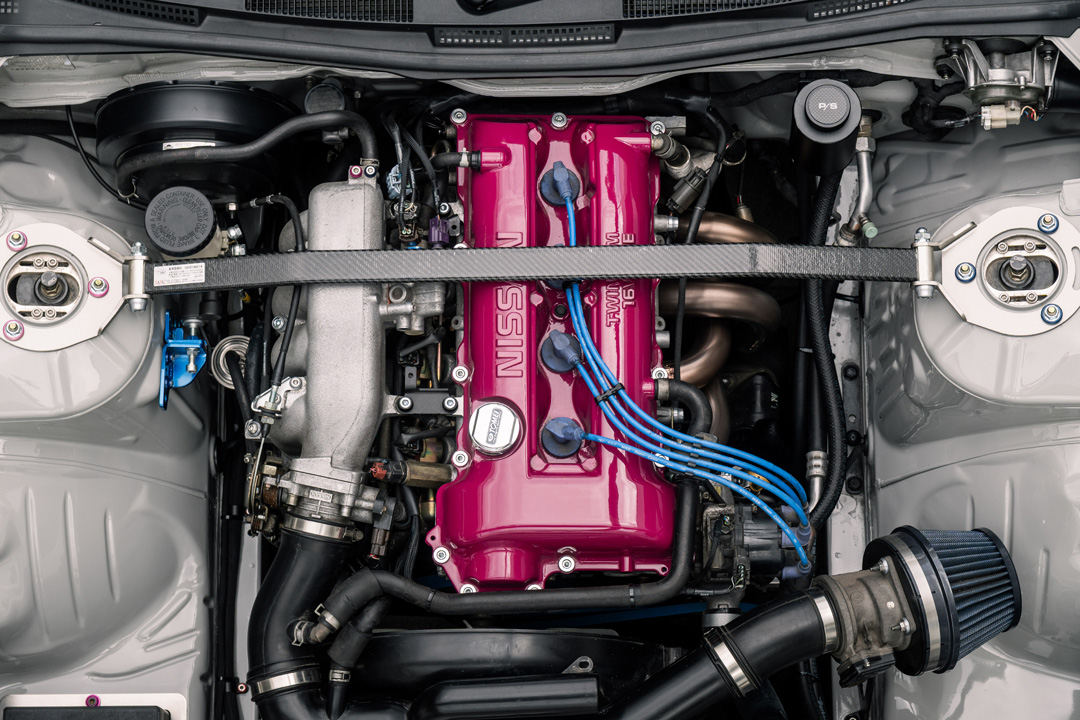 Bill MacKenzie’s Porsche Chalk 2000 Nissan Silvia S15 with handmade custom details, Nismo aero, Super Advan V2 wheels, naturally aspirated SR engine setup, and restomod-inspired interior and exterior work.