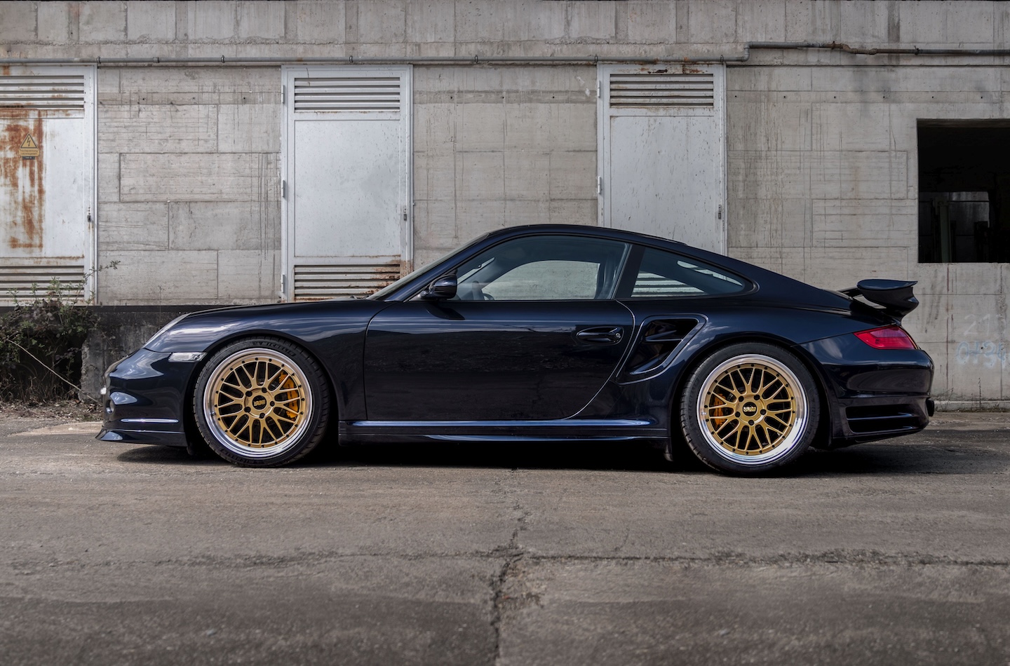 Porsche 911 997 shown in side profile with a lowered stance after installation of KW DDC Plug & Play coilovers.