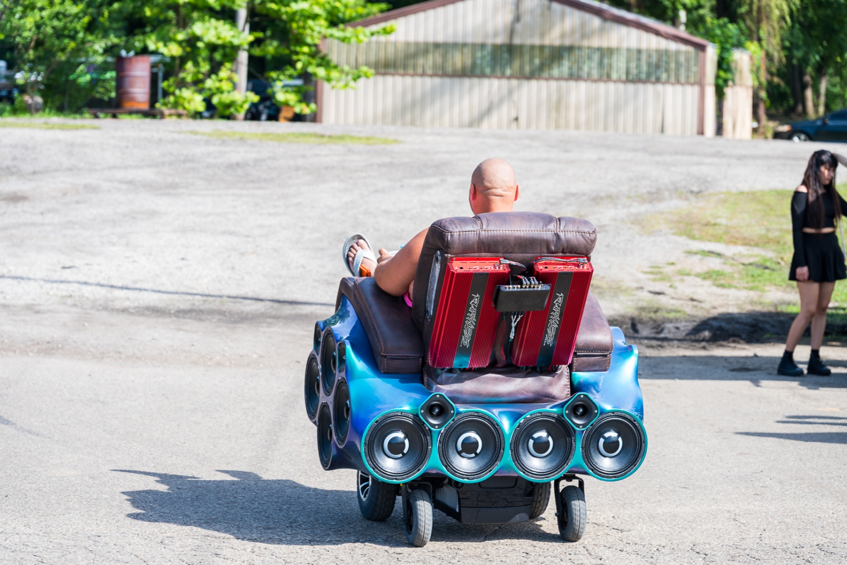 Custom motorized audio chair with speakers and amplifiers cruising at Slamology 2026 at Edgewater Sports Park.