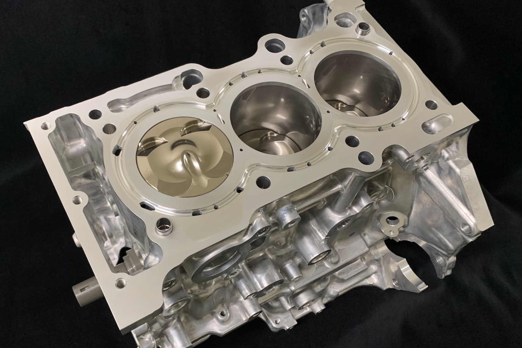 HKS G16E 1.75L LOW-COMP STEP3 CLOSED-DECK short block shown from above with machined deck surface, cylinder bores, and low-compression piston.