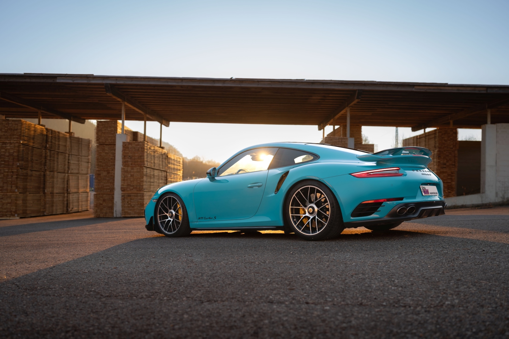 Blue Porsche 911 Turbo S 991 shown in side profile with KW DDC Plug &amp; Play coilover suspension.