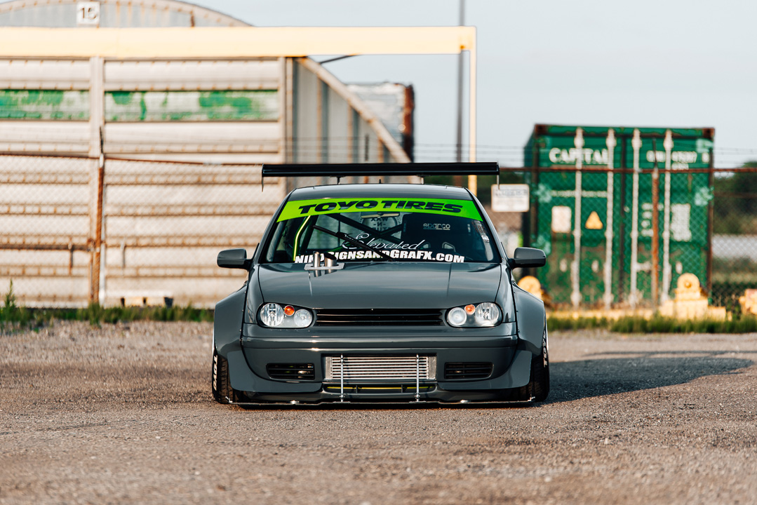 Widebody Volkswagen Golf GTI show build photographed for PASMAG with custom aero, deep wheels, interior details, and JB MAF craftsmanship.