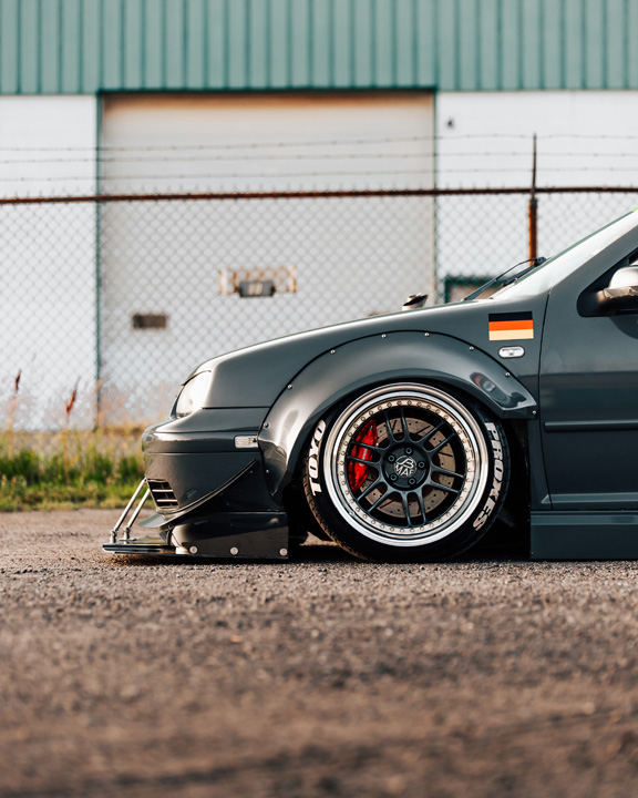 Widebody Volkswagen Golf GTI show build photographed for PASMAG with custom aero, deep wheels, interior details, and JB MAF craftsmanship.