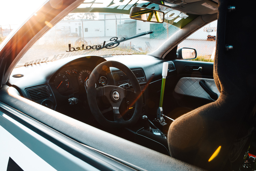 Widebody Volkswagen Golf GTI show build photographed for PASMAG with custom aero, deep wheels, interior details, and JB MAF craftsmanship.