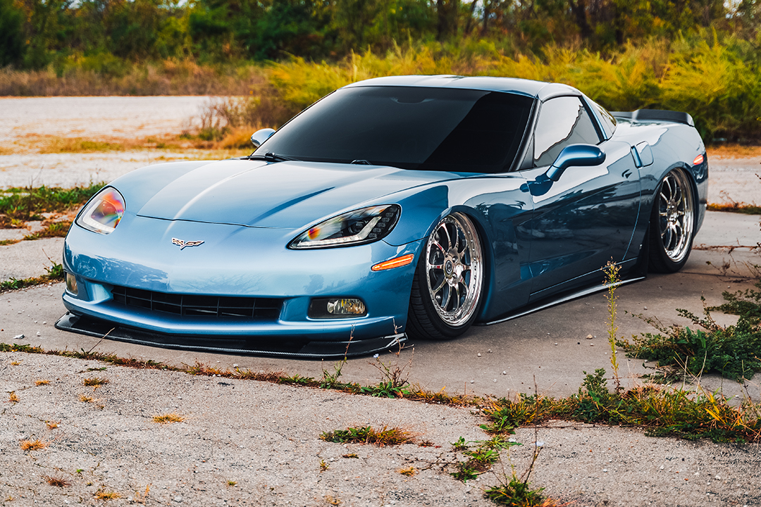 Dane Shuler’s 2008 Chevrolet Corvette aired out on HRE 543 three-piece wheels in a front three-quarter view.