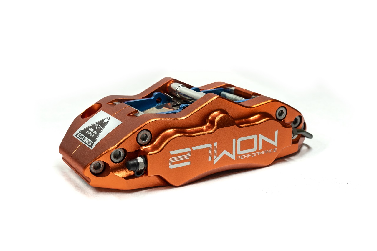 27WON fixed 4-piston front brake caliper in Sunset Orange for Honda Civic and Acura Integra applications.