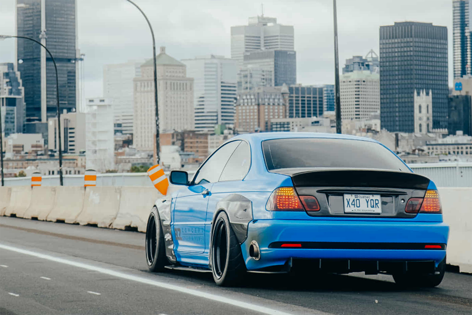 Rear three-quarter view of Jonathan St Pierre’s 2005 BMW 330Ci showing its Pandem widebody, CSL trunk and custom rear diffuser.