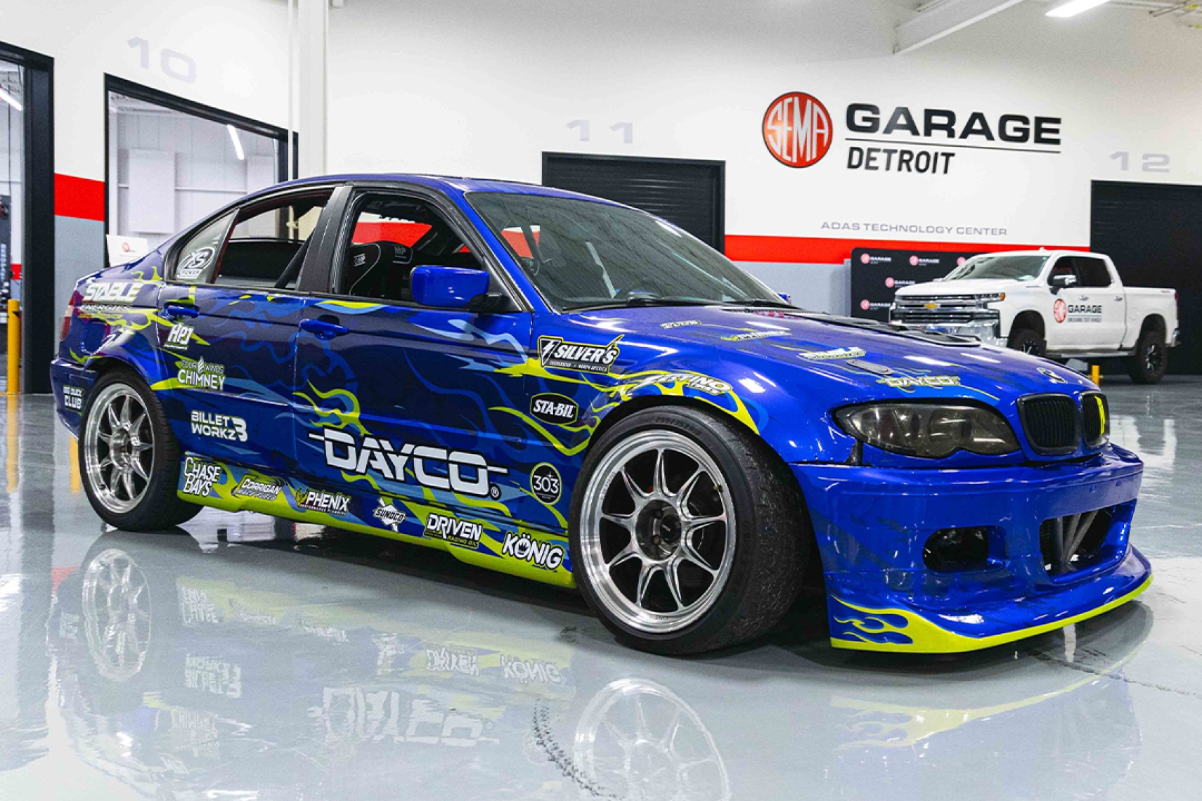 Chad Anderson’s 2002 BMW 325i Coyote-swapped drift car photographed at SEMA Garage Detroit.