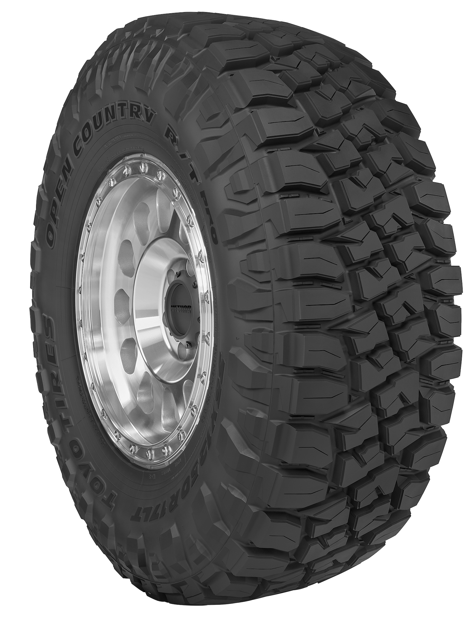 Three-quarter view of the Toyo Open Country R/T Pro rugged terrain tire mounted on a silver wheel, highlighting its aggressive tread and sidewall design.