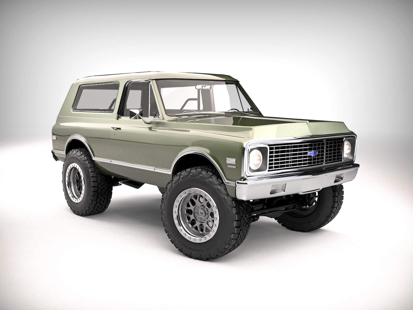 Front three-quarter view of Tony Arme's 1972 Chevrolet K5 Blazer featuring olive-green paint, chrome trim, KMC beadlock wheels and oversized Toyo Open Country A/T III tires.