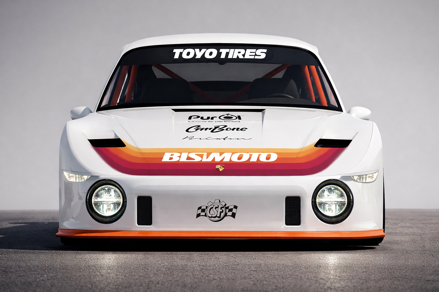 Front view of Bisimoto's electric 1979 Porsche 935 Baby Moby featuring white bodywork, retro orange and red racing stripes, and Toyo Tires branding.